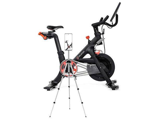 Indoor cycling bike displaying workout on phone